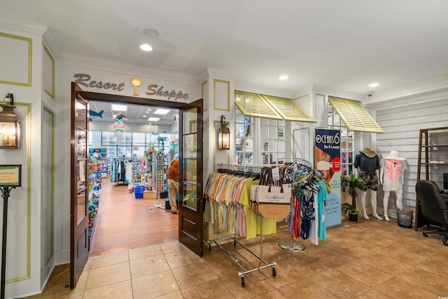 interior space with ornamental molding, tile patterned flooring, and recessed lighting