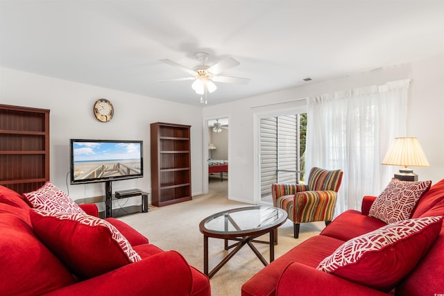 living room with light carpet and ceiling fan