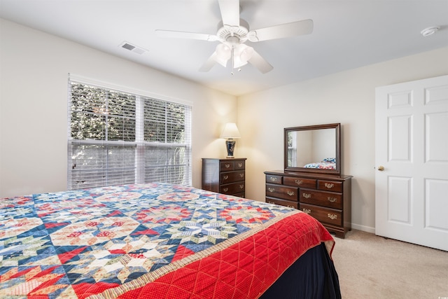 carpeted bedroom with ceiling fan