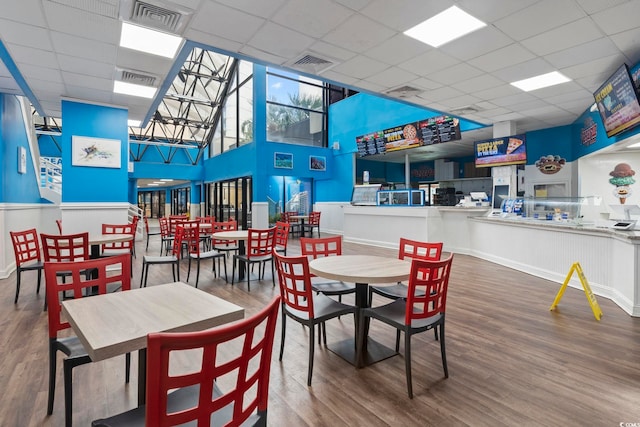 dining area featuring visible vents and wood finished floors