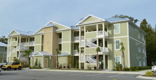 35 Delray Dr Unit 2-C, Murrells Inlet, SC 29576 - view of apartment building / complex with stairs and uncovered parking