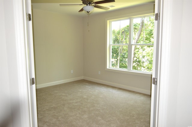 35 Delray Dr Unit 2-C, Murrells Inlet, SC 29576 - empty room with a ceiling fan, light carpet, and baseboards
