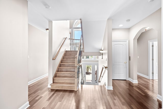 staircase featuring wood-type flooring