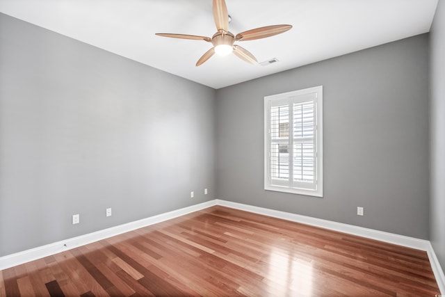 unfurnished room featuring ceiling fan and hardwood / wood-style flooring