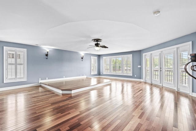 interior space with ceiling fan and hardwood / wood-style flooring