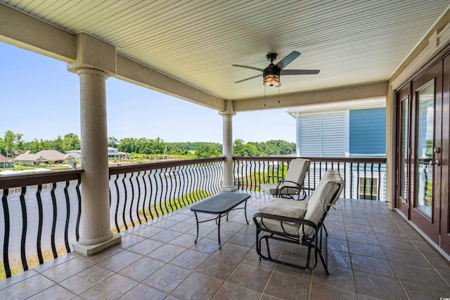 view of patio / terrace featuring ceiling fan and a balcony