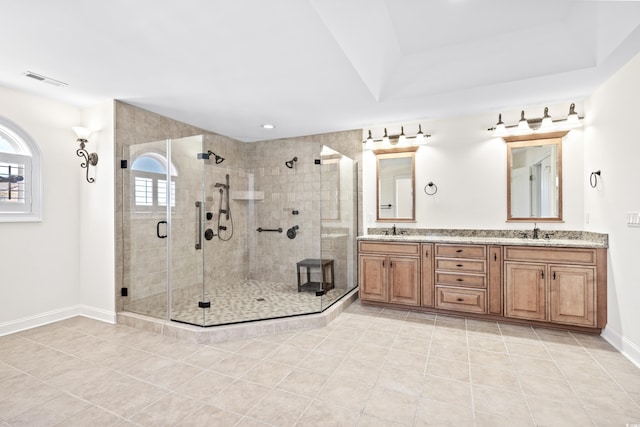 bathroom with vanity, tile patterned floors, and a shower with door