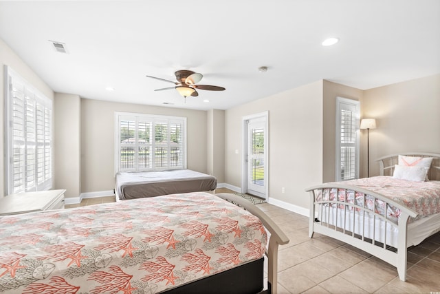 bedroom featuring access to exterior, ceiling fan, and light tile patterned flooring