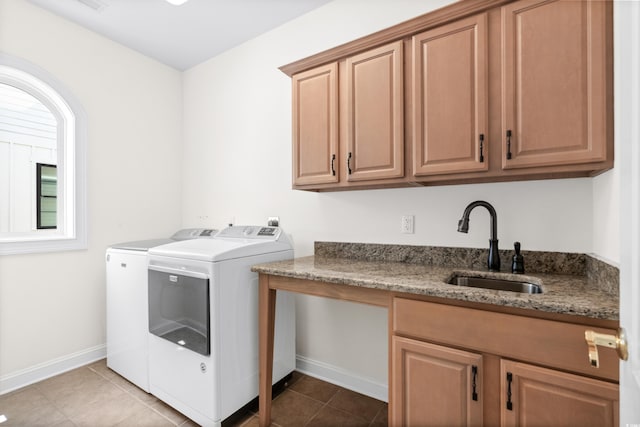 washroom featuring cabinets, washing machine and dryer, tile patterned flooring, and sink