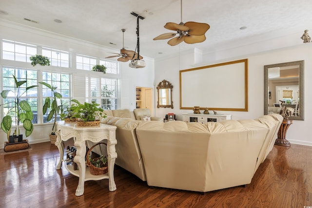 living room with ceiling fan, dark hardwood / wood-style flooring, and ornamental molding