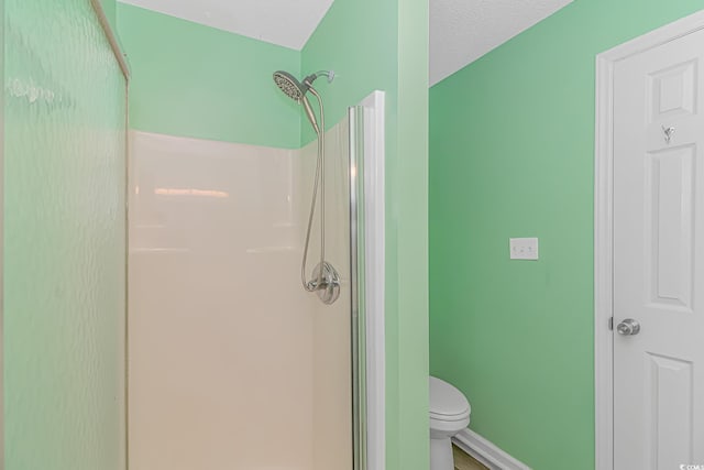 6001-5240 S Kings Hwy, Myrtle Beach, SC 29575 - bathroom with baseboards, a shower stall, and toilet