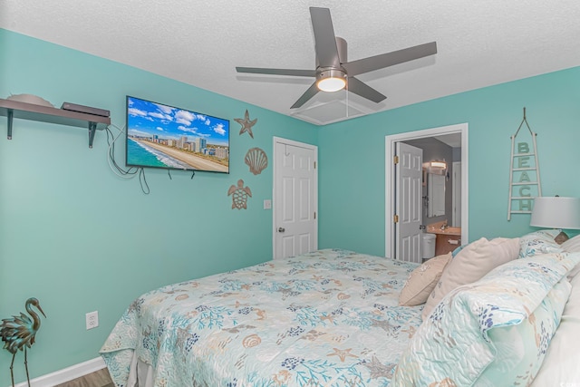 6001-5240 S Kings Hwy, Myrtle Beach, SC 29575 - bedroom with a textured ceiling, wood finished floors, ceiling fan, and ensuite bath