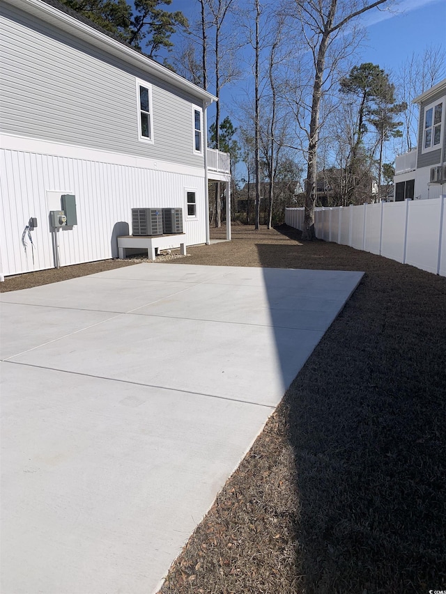 view of side of home featuring a patio area and a balcony