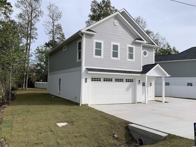 view of front facade with a garage and a front lawn