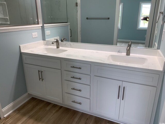 bathroom featuring vanity and hardwood / wood-style flooring