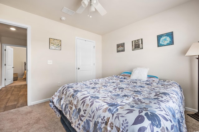 bedroom featuring ceiling fan and carpet