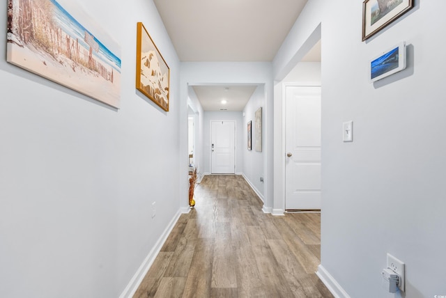 hallway featuring light wood-type flooring