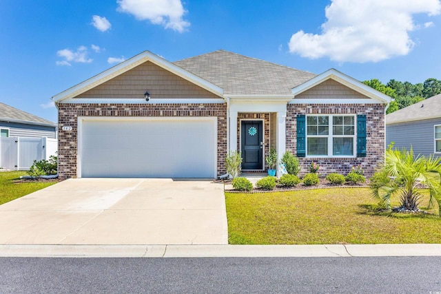 craftsman house with a garage and a front lawn