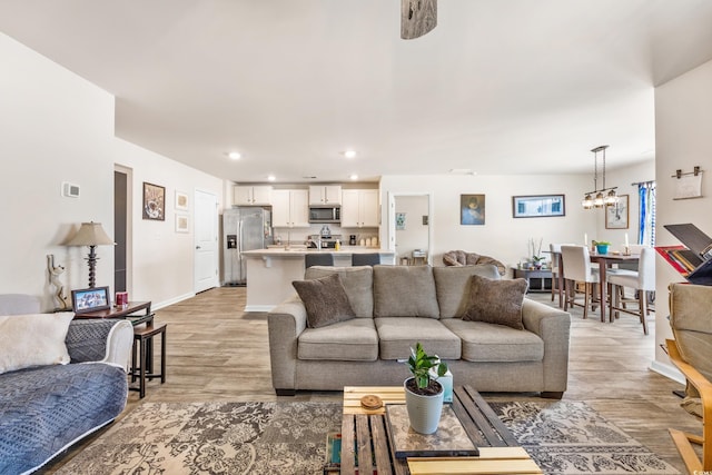 living room with light hardwood / wood-style flooring