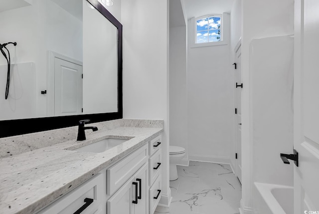 bathroom with toilet and vanity