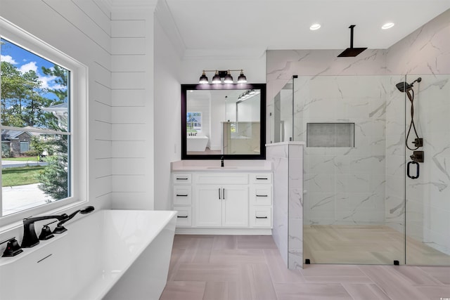 bathroom featuring independent shower and bath, a wealth of natural light, crown molding, and vanity