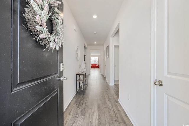 corridor with wood-type flooring