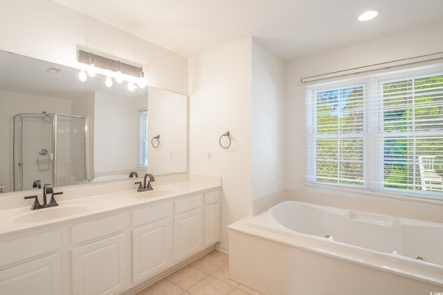 bathroom with vanity, shower with separate bathtub, and tile patterned floors