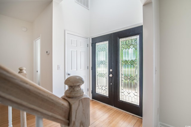 entryway featuring french doors and light wood-type flooring