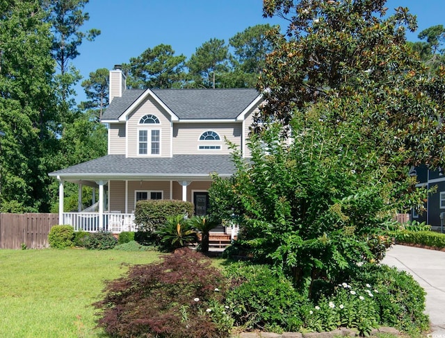 view of front facade featuring a porch and a front lawn