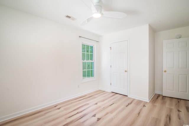 unfurnished bedroom with a closet, ceiling fan, and light hardwood / wood-style flooring