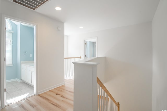 corridor featuring light hardwood / wood-style flooring