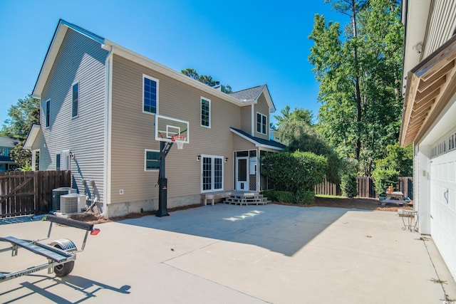 back of house featuring central air condition unit and a patio area