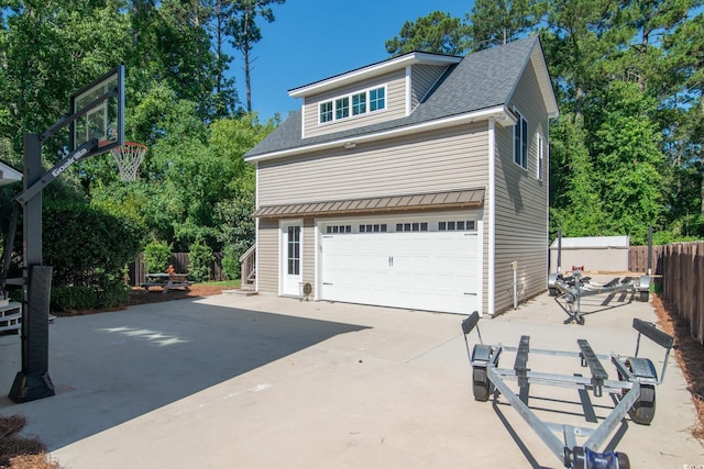 view of property exterior with a garage