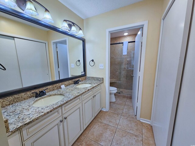 kitchen featuring appliances with stainless steel finishes, a textured ceiling, vaulted ceiling, and sink