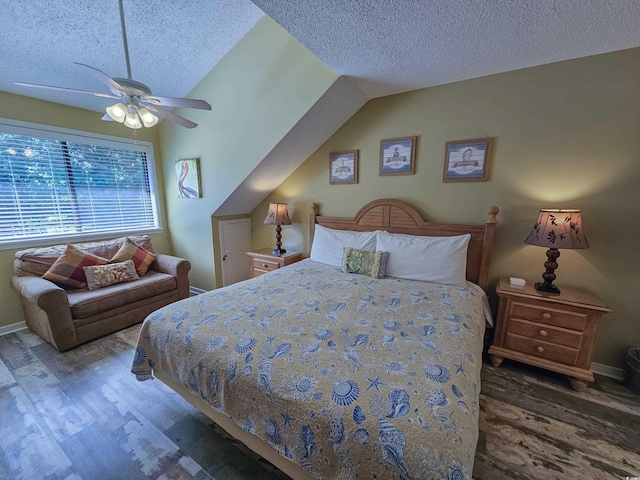 bedroom featuring vaulted ceiling, ceiling fan, dark hardwood / wood-style floors, and a textured ceiling