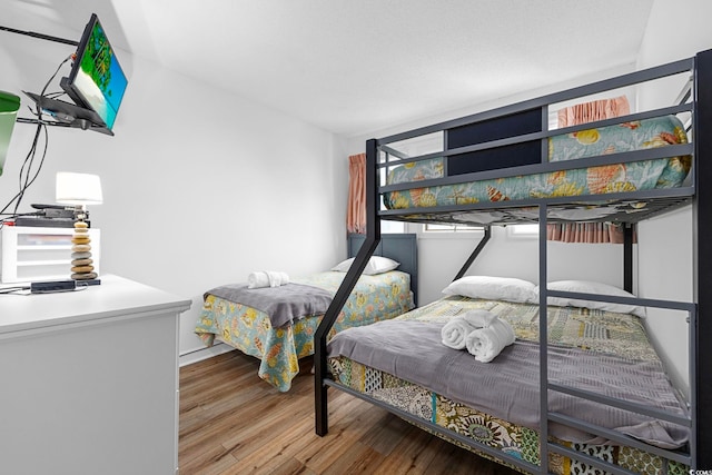 bedroom featuring wood finished floors