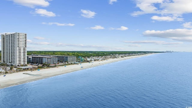 aerial view featuring a view of city, a water view, and a beach view