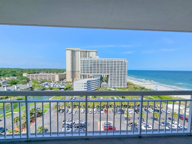 balcony with a view of the beach and a water view