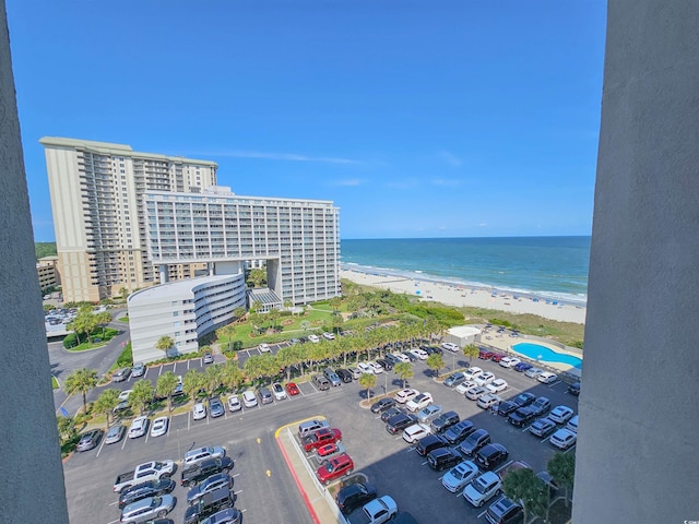 birds eye view of property with a beach view and a water view