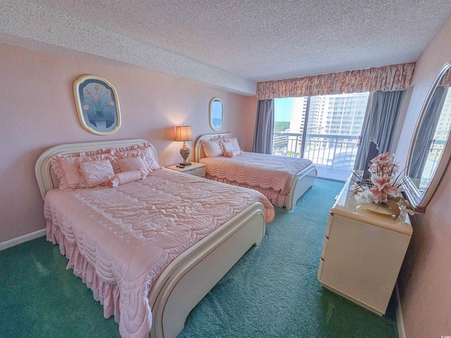 bedroom with a textured ceiling, carpet flooring, and access to outside