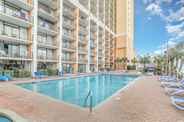 view of pool featuring a patio area