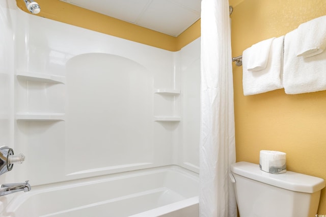 bathroom with toilet and shower / tub combo with curtain