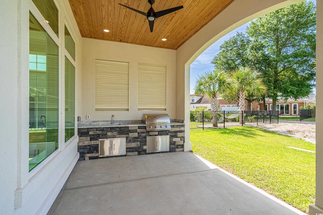 view of patio / terrace featuring ceiling fan, sink, and area for grilling