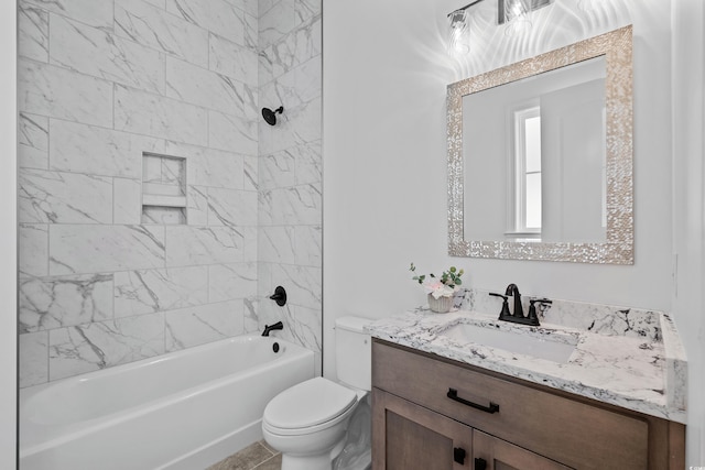 full bathroom with tiled shower / bath combo, vanity, and toilet