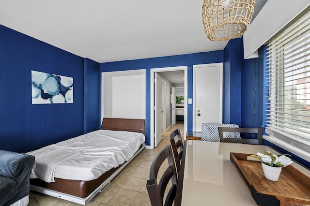 bedroom with light tile patterned floors