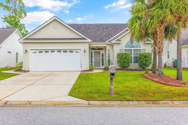 ranch-style house featuring a front lawn and a garage