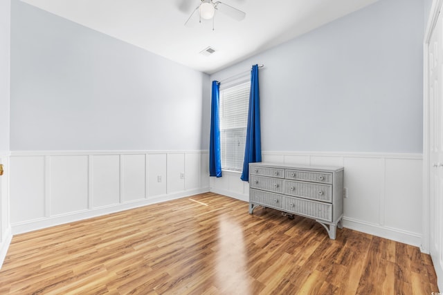 unfurnished bedroom featuring light wood-type flooring and ceiling fan