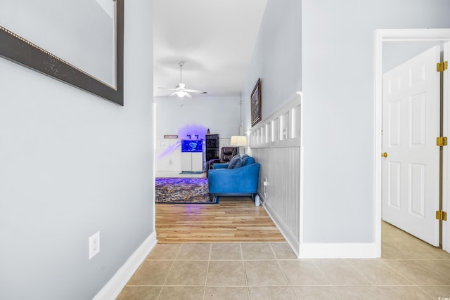 corridor with light tile patterned flooring