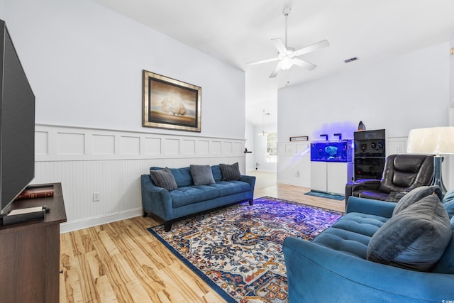 living room with hardwood / wood-style flooring and ceiling fan