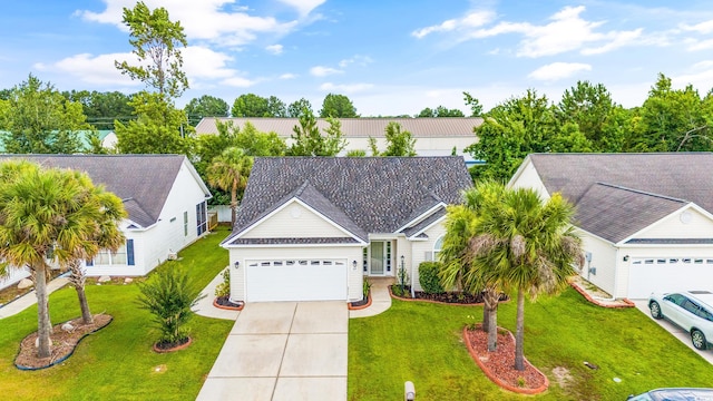 view of front facade with a front yard and a garage